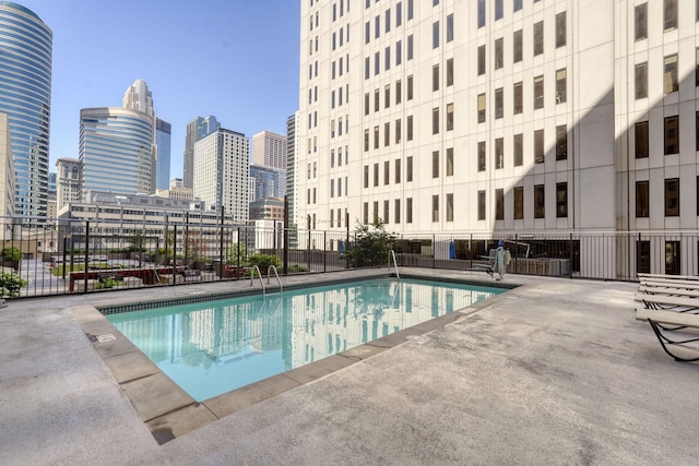 121 Washington Ave S Unit 513, Minneapolis, MN 55401 - community pool with a skyline view and a patio