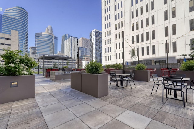 121 Washington Ave S Unit 513, Minneapolis, MN 55401 - view of patio / terrace with a skyline view and grilling area