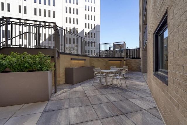 121 Washington Ave S Unit 513, Minneapolis, MN 55401 - view of patio / terrace featuring outdoor dining area and stairway