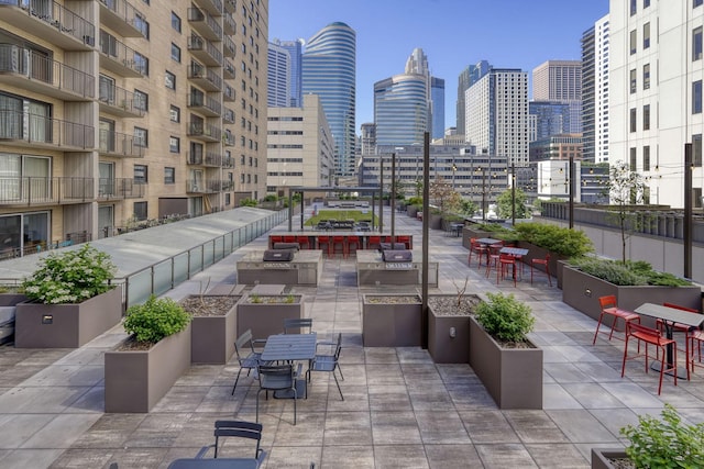 121 Washington Ave S Unit 513, Minneapolis, MN 55401 - view of patio / terrace featuring a skyline view and outdoor dining space