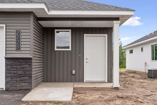 2728 229th Ln NW, Saint Francis, MN 55070 - doorway to property featuring roof with shingles and board and batten siding
