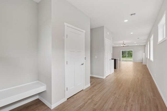 2728 229th Ln NW, Saint Francis, MN 55070 - hallway with a chandelier, light wood-type flooring, and recessed lighting