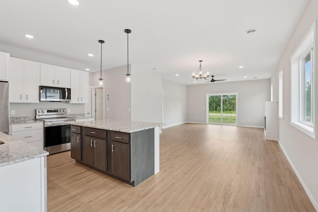 2728 229th Ln NW, Saint Francis, MN 55070 - kitchen with stainless steel appliances, white cabinetry, light wood-style flooring, dark brown cabinets, and recessed lighting