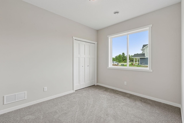 2728 229th Ln NW, Saint Francis, MN 55070 - unfurnished bedroom with carpet floors and a closet
