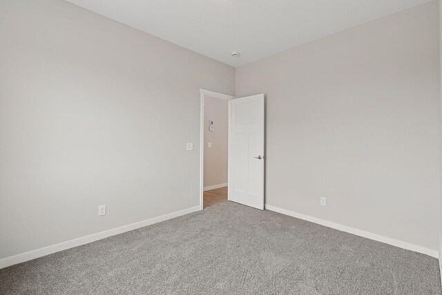 2728 229th Ln NW, Saint Francis, MN 55070 - unfurnished room featuring carpet floors and baseboards