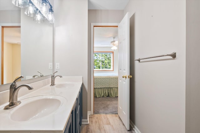 8731 Quarry Ridge Ln Unit B, Woodbury, MN 55125 - ensuite bathroom featuring double vanity and wood finished floors