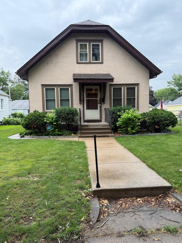4045 44th Ave S, Minneapolis, MN 55406 - bungalow featuring stucco siding and a front lawn
