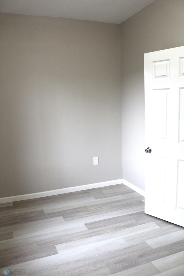 921 6th Ave N, Fargo, ND 58102 - spare room featuring baseboards and wood finished floors