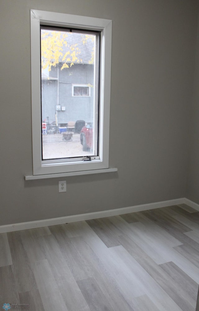 921 6th Ave N, Fargo, ND 58102 - empty room featuring wood finished floors and plenty of natural light