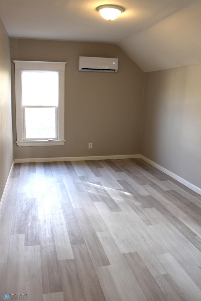 921 6th Ave N, Fargo, ND 58102 - bonus room with an AC wall unit, wood finished floors, and lofted ceiling