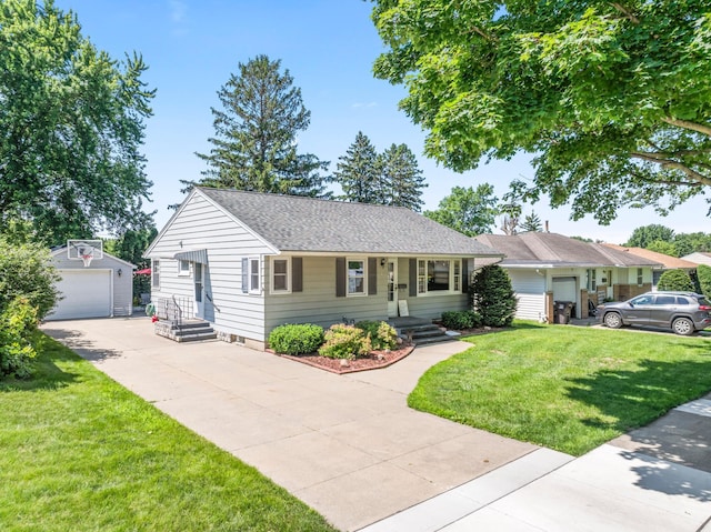 1917 2nd Ave NW, Austin, MN 55912 - ranch-style home with an outbuilding, concrete driveway, a front lawn, and a garage