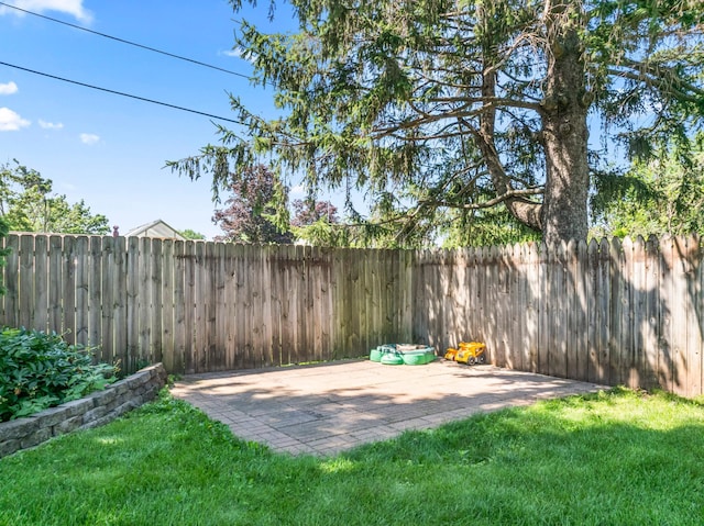 1917 2nd Ave NW, Austin, MN 55912 - fenced backyard featuring a patio area