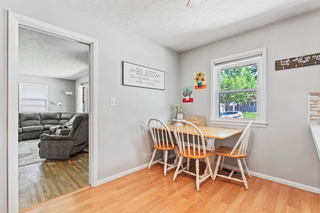 1917 2nd Ave NW, Austin, MN 55912 - dining space featuring a textured ceiling and light wood-type flooring