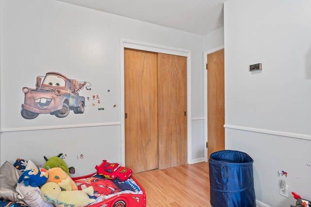 1917 2nd Ave NW, Austin, MN 55912 - bedroom featuring wood finished floors and a closet