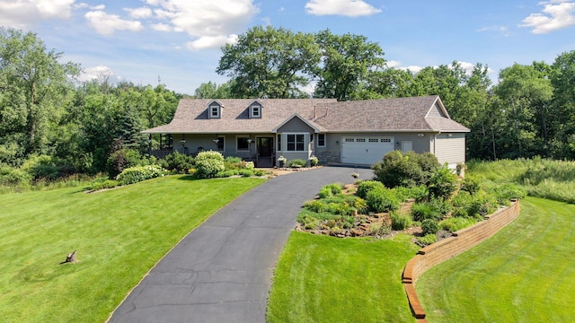 11985 Lever Ct NE, Blaine, MN 55449 - view of front of house with a front lawn, a garage, and asphalt driveway