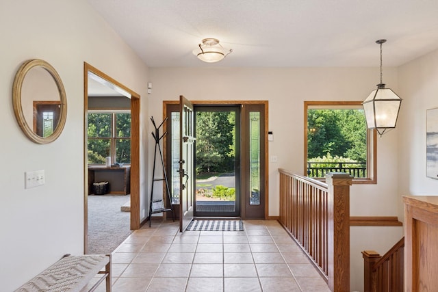 11985 Lever Ct NE, Blaine, MN 55449 - entrance foyer featuring healthy amount of natural light, light tile patterned floors, and light colored carpet