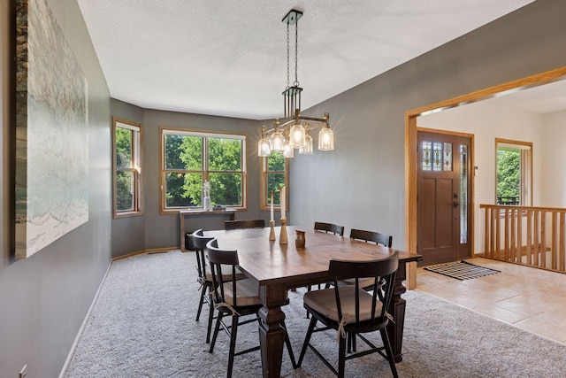 11985 Lever Ct NE, Blaine, MN 55449 - carpeted dining room featuring plenty of natural light, a chandelier, tile patterned floors, and a textured ceiling