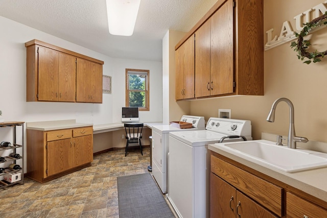 11985 Lever Ct NE, Blaine, MN 55449 - laundry room with cabinet space, washing machine and dryer, stone finish floors, an office area, and a textured ceiling