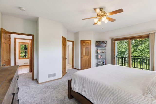 11985 Lever Ct NE, Blaine, MN 55449 - bedroom with access to outside, light carpet, and ceiling fan