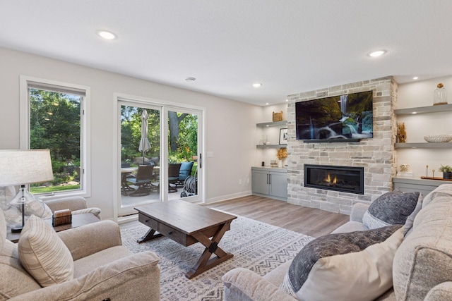 11985 Lever Ct NE, Blaine, MN 55449 - living area with light wood-style floors, a fireplace, and recessed lighting