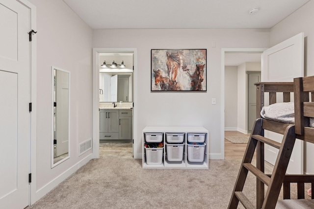 11985 Lever Ct NE, Blaine, MN 55449 - bedroom featuring light colored carpet and ensuite bath