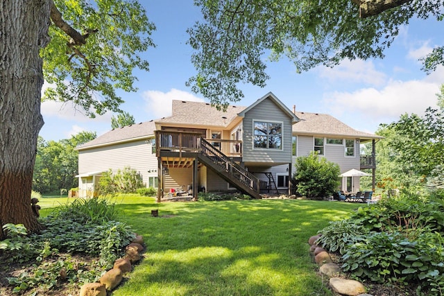 11985 Lever Ct NE, Blaine, MN 55449 - back of house with stairs, a wooden deck, and a lawn