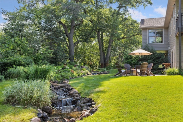11985 Lever Ct NE, Blaine, MN 55449 - view of grassy yard featuring a fire pit