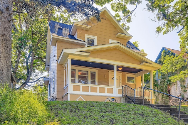 3014 Humboldt Ave N, Minneapolis, MN 55411 - view of front of home featuring covered porch and a shingled roof