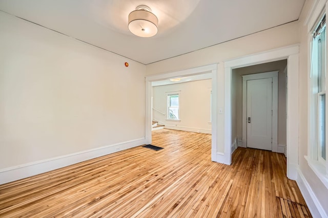 3014 Humboldt Ave N, Minneapolis, MN 55411 - spare room with light wood-style flooring and stairway