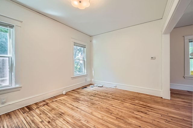 3014 Humboldt Ave N, Minneapolis, MN 55411 - spare room featuring plenty of natural light and wood-type flooring