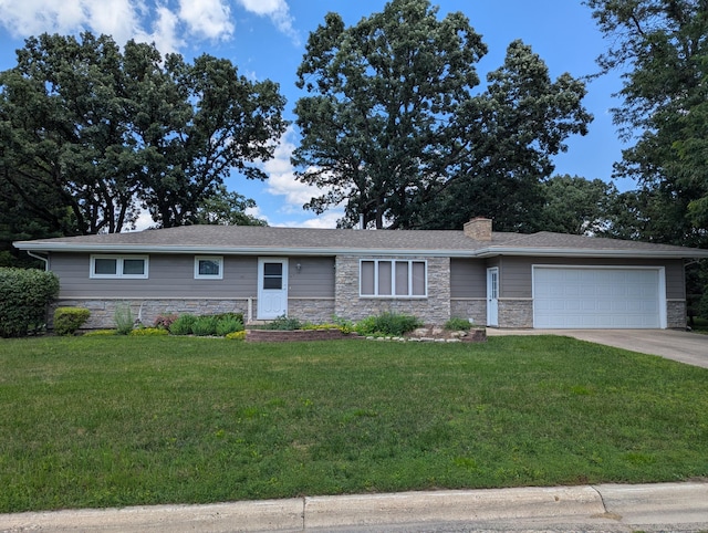 417 Ridge Rd, Albert Lea, MN 56007 - ranch-style home featuring stone siding, a garage, a chimney, a front lawn, and concrete driveway