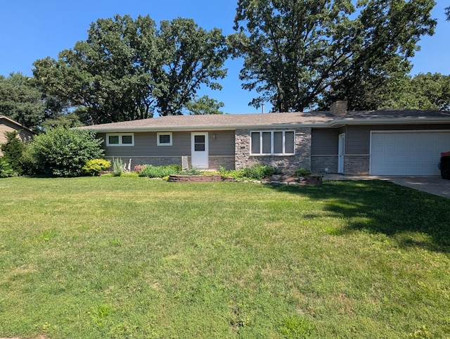 417 Ridge Rd, Albert Lea, MN 56007 - ranch-style house with an attached garage, a chimney, stone siding, a front lawn, and concrete driveway