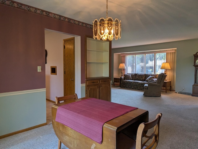 417 Ridge Rd, Albert Lea, MN 56007 - dining space featuring light carpet and a chandelier