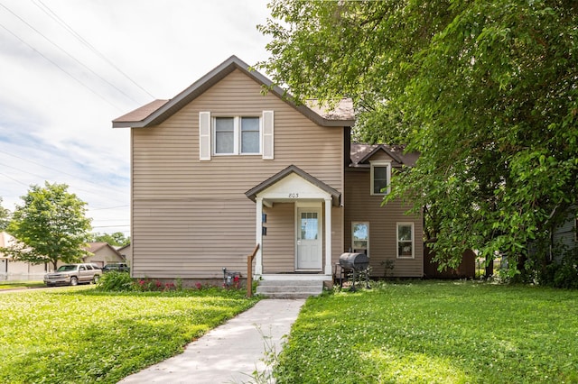 803 5th St, Winona, MN 55987 - traditional-style home featuring a front lawn and a chimney