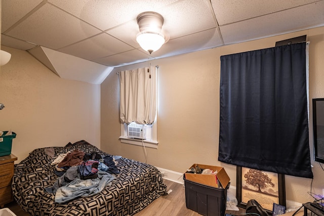 803 5th St, Winona, MN 55987 - bedroom featuring wood finished floors, a drop ceiling, and cooling unit