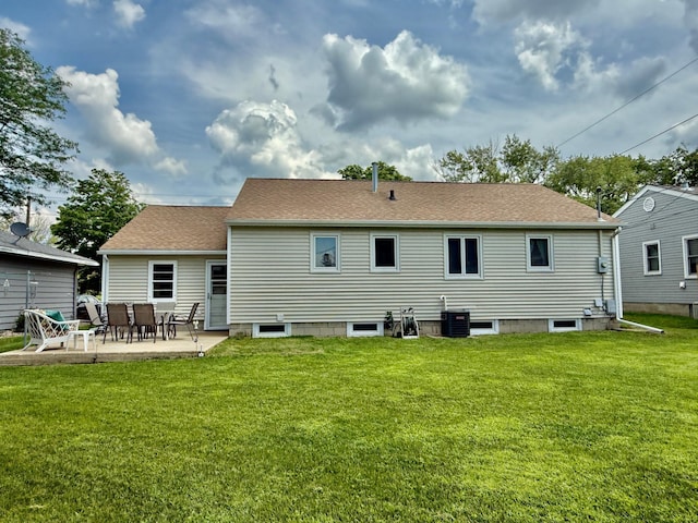 905 Clausen Ave, Albert Lea, MN 56007 - rear view of house with a yard, a patio area, and roof with shingles