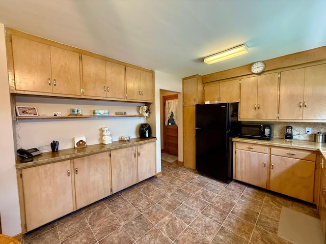 905 Clausen Ave, Albert Lea, MN 56007 - kitchen with black appliances, decorative backsplash, light countertops, stone finish flooring, and open shelves