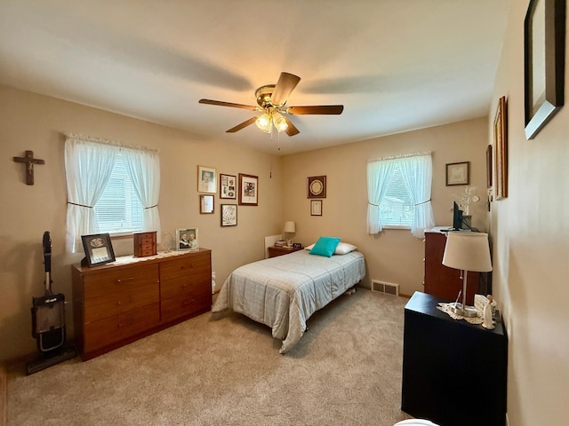 905 Clausen Ave, Albert Lea, MN 56007 - bedroom with light colored carpet and a ceiling fan