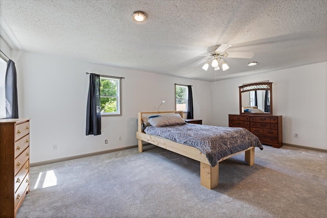 602 8th St NW, Chisholm, MN 55719 - carpeted bedroom featuring a textured ceiling and ceiling fan