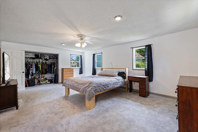 602 8th St NW, Chisholm, MN 55719 - carpeted bedroom featuring a closet, a textured ceiling, and ceiling fan