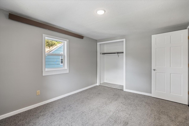 602 8th St NW, Chisholm, MN 55719 - unfurnished bedroom with carpet flooring, a closet, and a textured ceiling