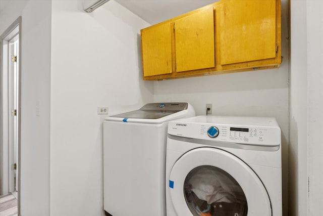 602 8th St NW, Chisholm, MN 55719 - laundry room featuring cabinet space and washer and clothes dryer