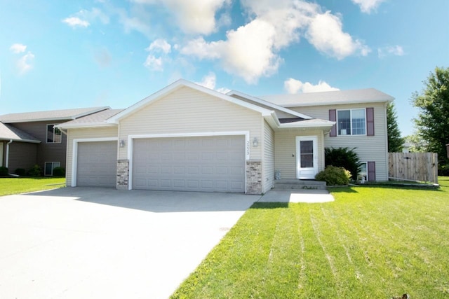 2223 Fairbanks Dr, North Mankato, MN 56003 - view of front facade featuring an attached garage and driveway