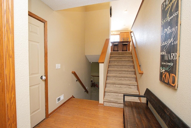 2223 Fairbanks Dr, North Mankato, MN 56003 - staircase featuring wood finished floors