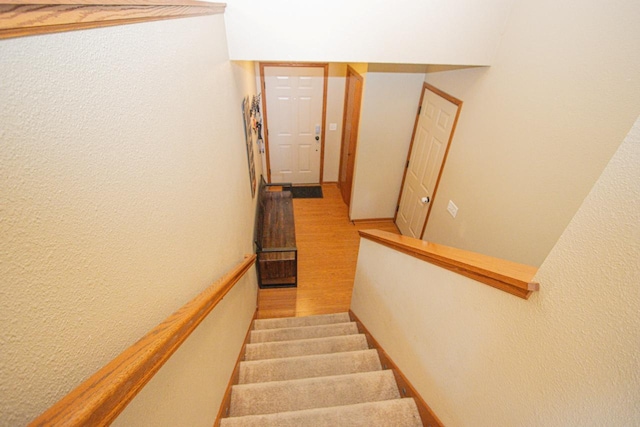 2223 Fairbanks Dr, North Mankato, MN 56003 - stairs with a textured wall and wood finished floors