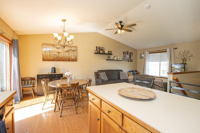 2223 Fairbanks Dr, North Mankato, MN 56003 - kitchen with light wood finished floors, ceiling fan, lofted ceiling, hanging light fixtures, and light countertops