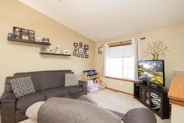 2223 Fairbanks Dr, North Mankato, MN 56003 - carpeted living area featuring lofted ceiling and baseboards