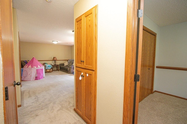 2223 Fairbanks Dr, North Mankato, MN 56003 - corridor with light colored carpet and a textured ceiling