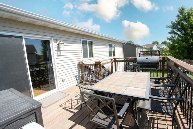 2223 Fairbanks Dr, North Mankato, MN 56003 - wooden terrace with outdoor dining space and a grill