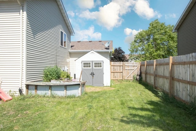 2223 Fairbanks Dr, North Mankato, MN 56003 - fenced backyard featuring a storage unit